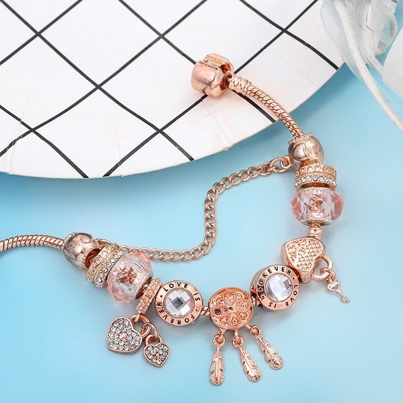 Rosa Armband met Charms en Zilveren Dreamcatcher
