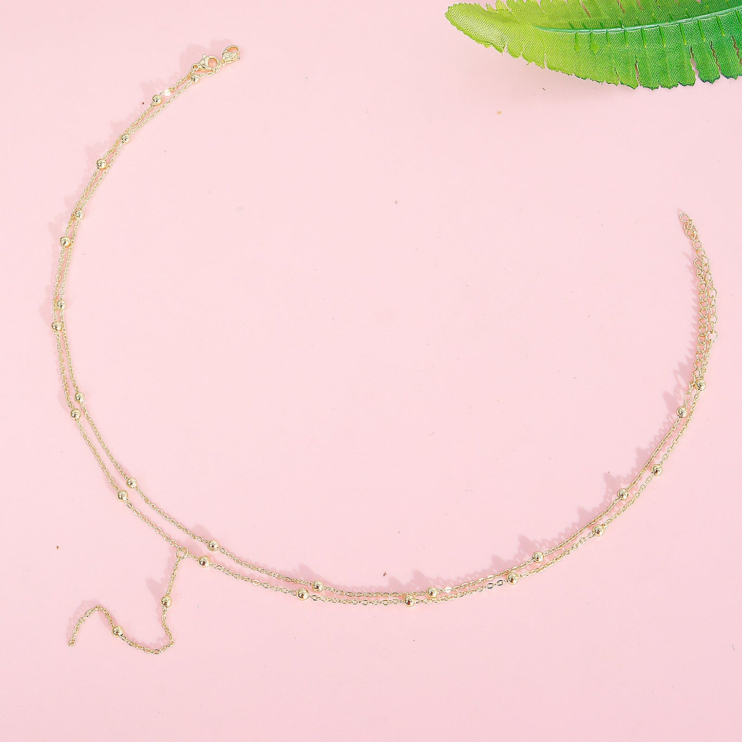 Ketting met Fijne Bolletjes en Elegante Hangende Oorbellen