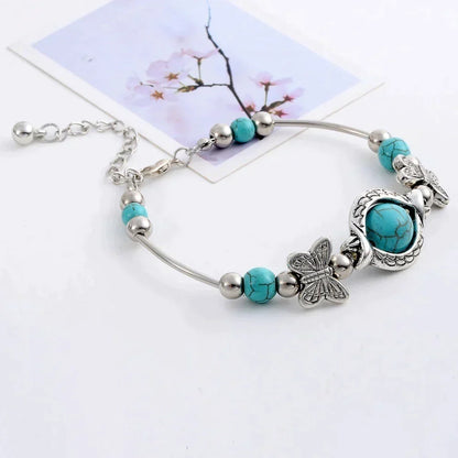Kralenarmband met Turquoise Vlinder Bedels