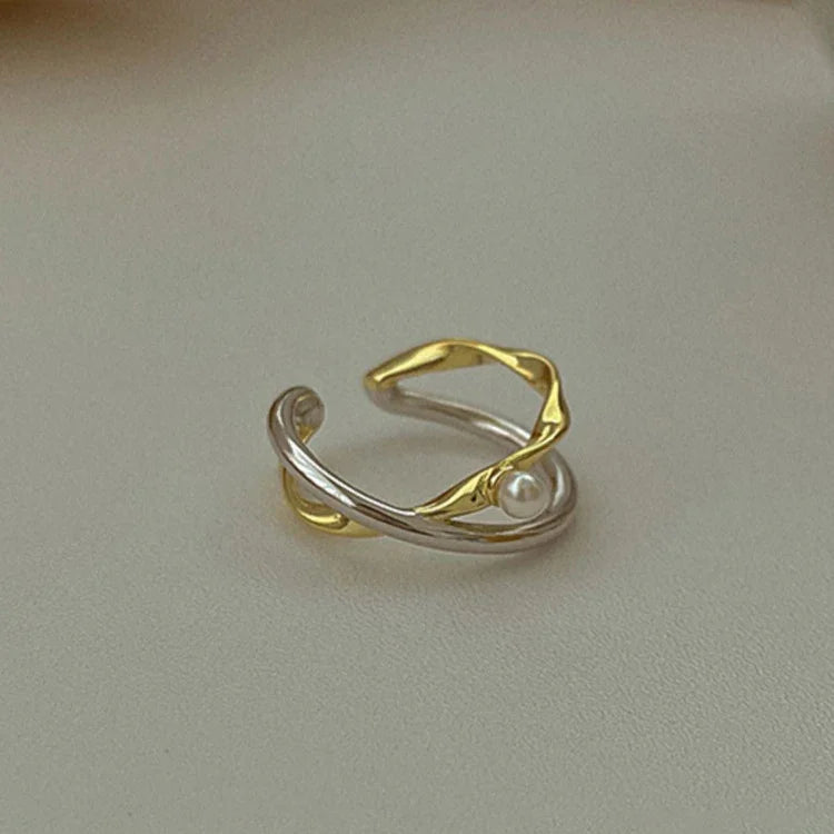 Zilveren Gekruiste Ring met Parel Edelmetaal