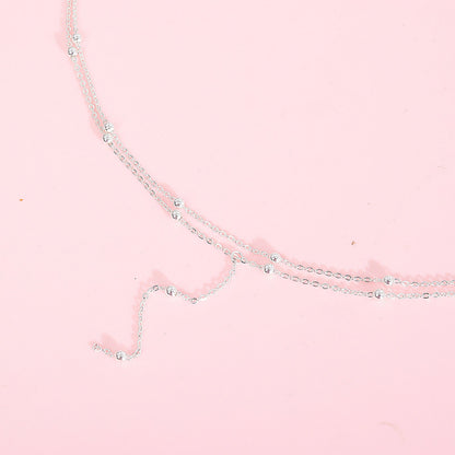 Ketting met Fijne Bolletjes en Elegante Hangende Oorbellen
