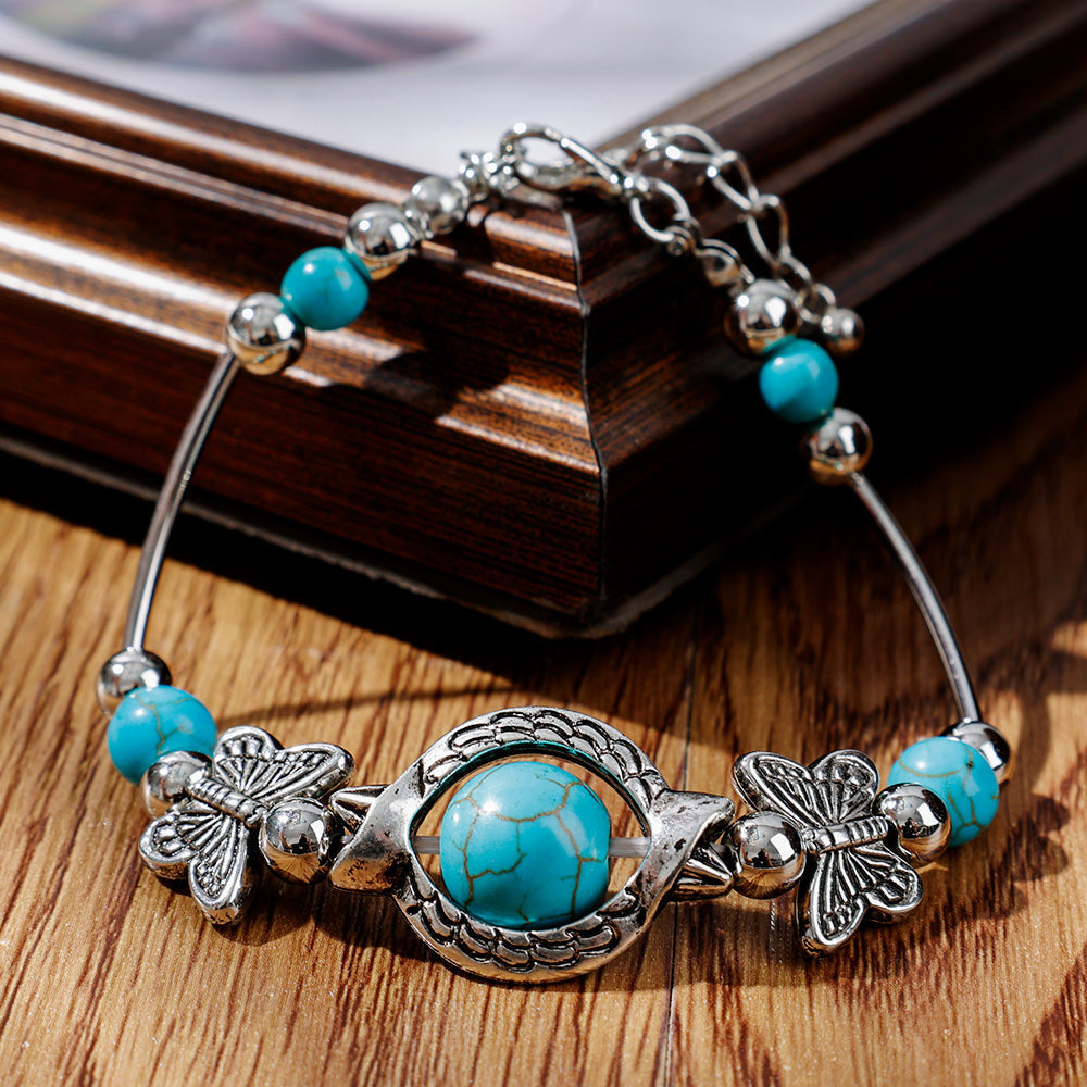Kralenarmband met Turquoise Vlinder Bedels