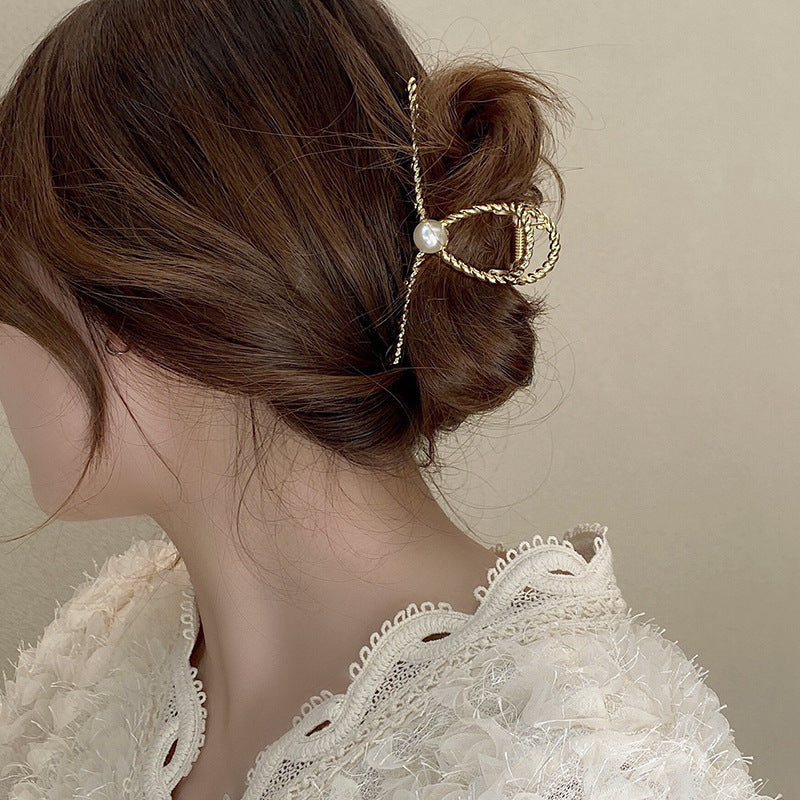 Dames Haarclip met Parel en Gedraaid Metaal Design