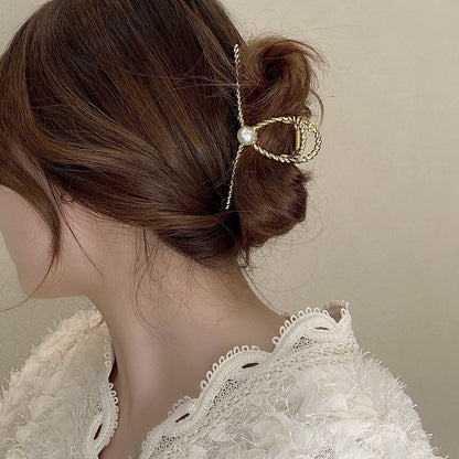 Dames Haarclip met Parel en Gedraaid Metaal Design