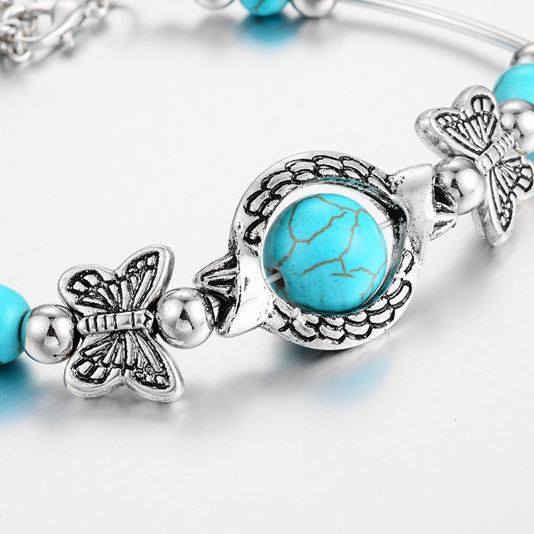 Kralenarmband met Turquoise Vlinder Bedels