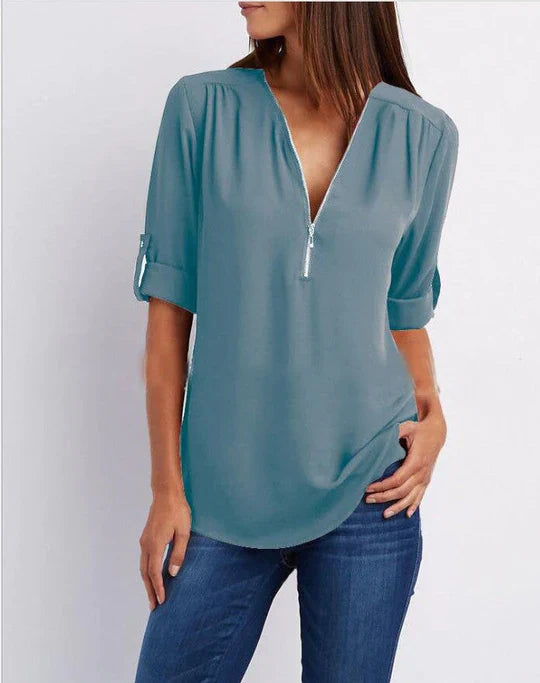 Vrouwelijke Blouse met Halve Rits en Elegante Halslijn