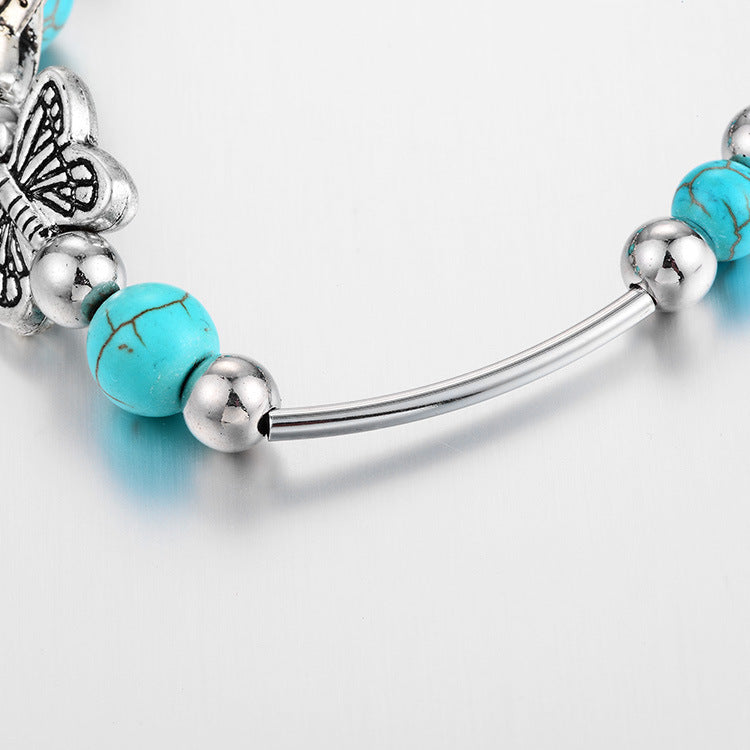 Kralenarmband met Turquoise Vlinder Bedels