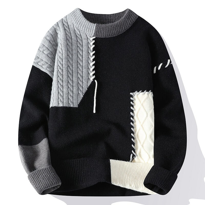 Frostina comfortabele sweater in zwart met grijze en witte kabelpatronen, gecombineerd met gedetailleerde stiksels voor een trendy en moderne uitstraling.