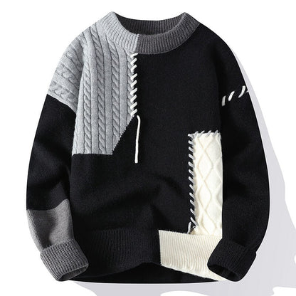 Frostina comfortabele sweater in zwart met grijze en witte kabelpatronen, gecombineerd met gedetailleerde stiksels voor een trendy en moderne uitstraling.