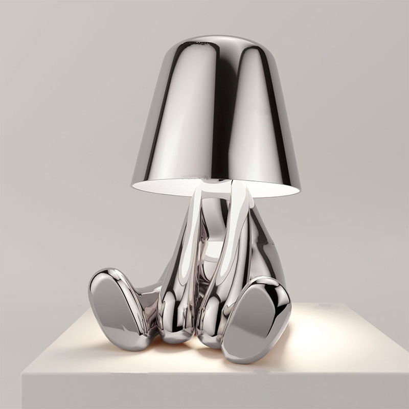 Moderne zilveren Lumineer tafellamp met een creatief en stijlvol ontwerp, ideaal voor flexibele verlichting en een eigentijdse uitstraling in uw interieur.
