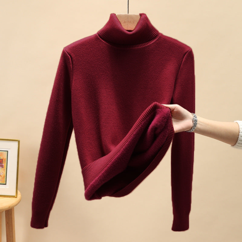 Mistra stijlvolle en comfortabele bordeauxrode trui met col en lange mouwen. De trui heeft een zachte, warme voering zichtbaar aan de binnenkant, perfect voor een knusse en elegante uitstraling in de winter.