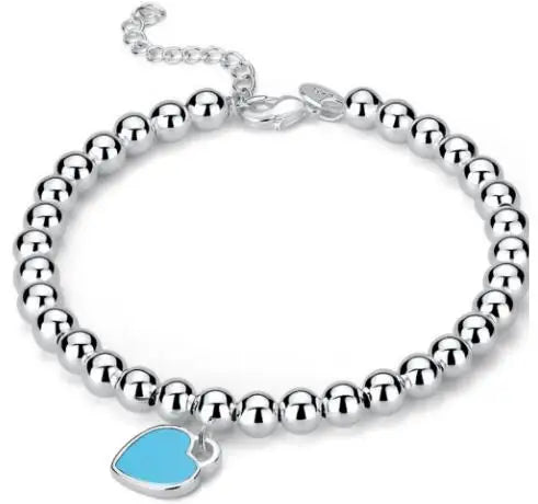 Elegante Zilveren Armband met Hartenkralen en Hartenhanger - Mode Vibes