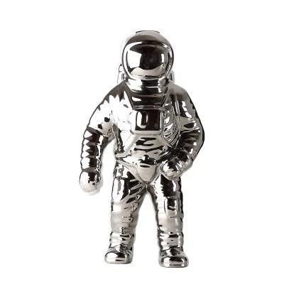 OriaDecor bloemenhouder in de vorm van een astronaut, uitgevoerd in glanzend zilverkleurig keramiek. Een modern en creatief ontwerp dat zorgt voor een unieke en speelse uitstraling in elk interieur. Perfect als decoratief item of plantenhouder.
