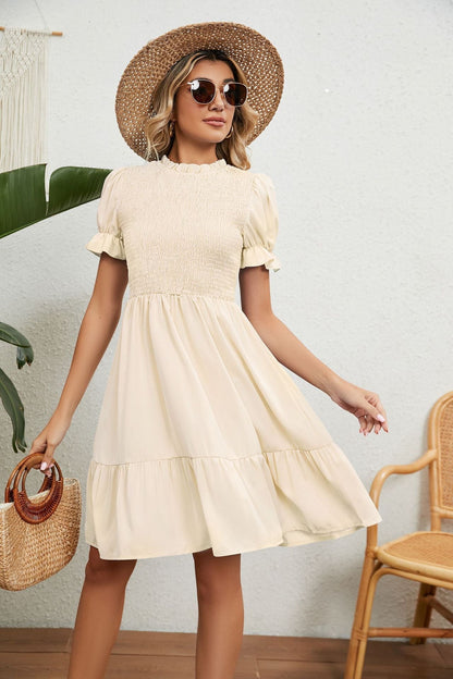 Beige zomerjurk met franjes