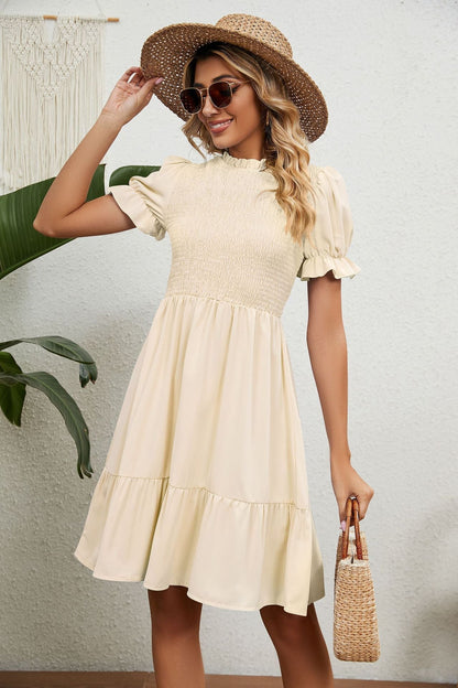 Beige zomerjurk met franjes