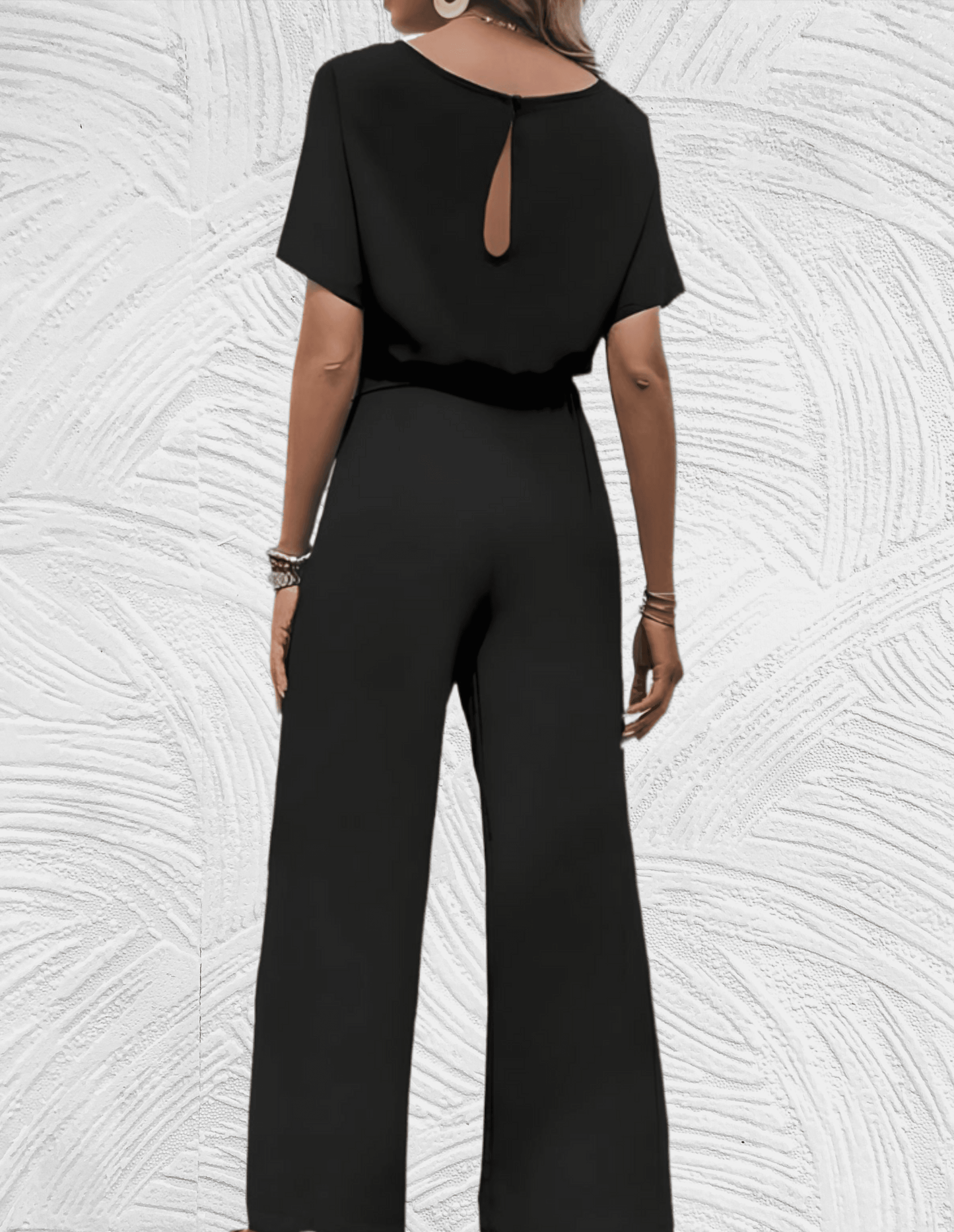 Velanora-  Mooi aansluitende jumpsuit met wijde mouwen en wijde pijpen met strikbandjes aan de zijkant