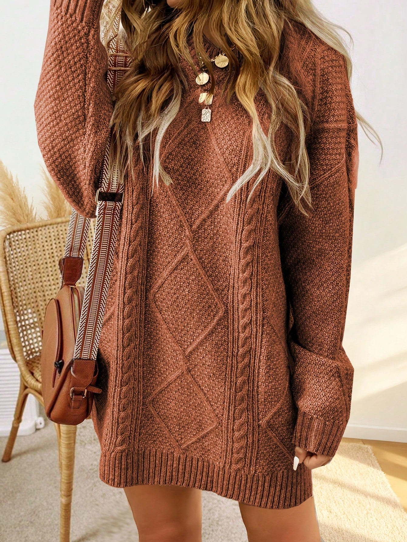 Trui jurk met kabelpatroon en ribbelafwerking