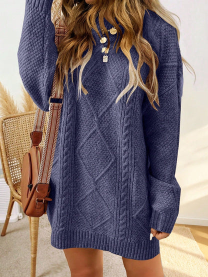 Trui jurk met kabelpatroon en ribbelafwerking