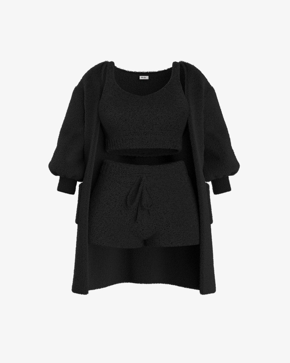 Zwart fleece set bestaande uit een zachte top, trui en korte broek, ideaal voor warmte en comfort.