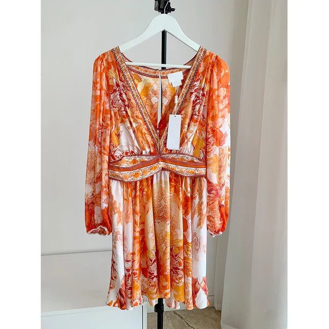 ModeMysterie Diepe V Vakantie Diner Zomerjurk met Oranje Print