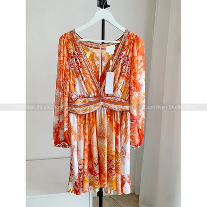 ModeMysterie Diepe V Vakantie Diner Zomerjurk met Oranje Print