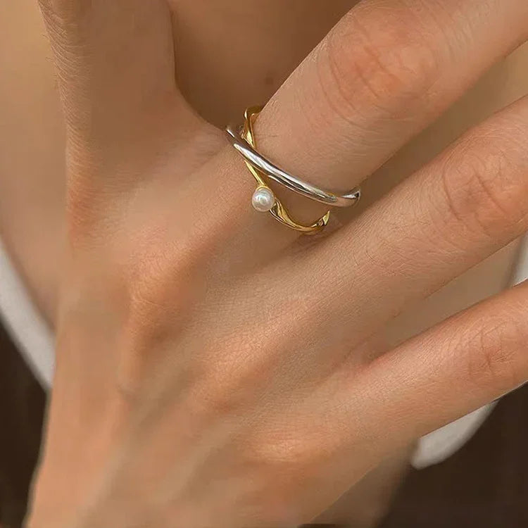 Zilveren Gekruiste Ring met Parel Edelmetaal