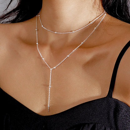 Ketting met Fijne Bolletjes en Elegante Hangende Oorbellen - Mode Vibes