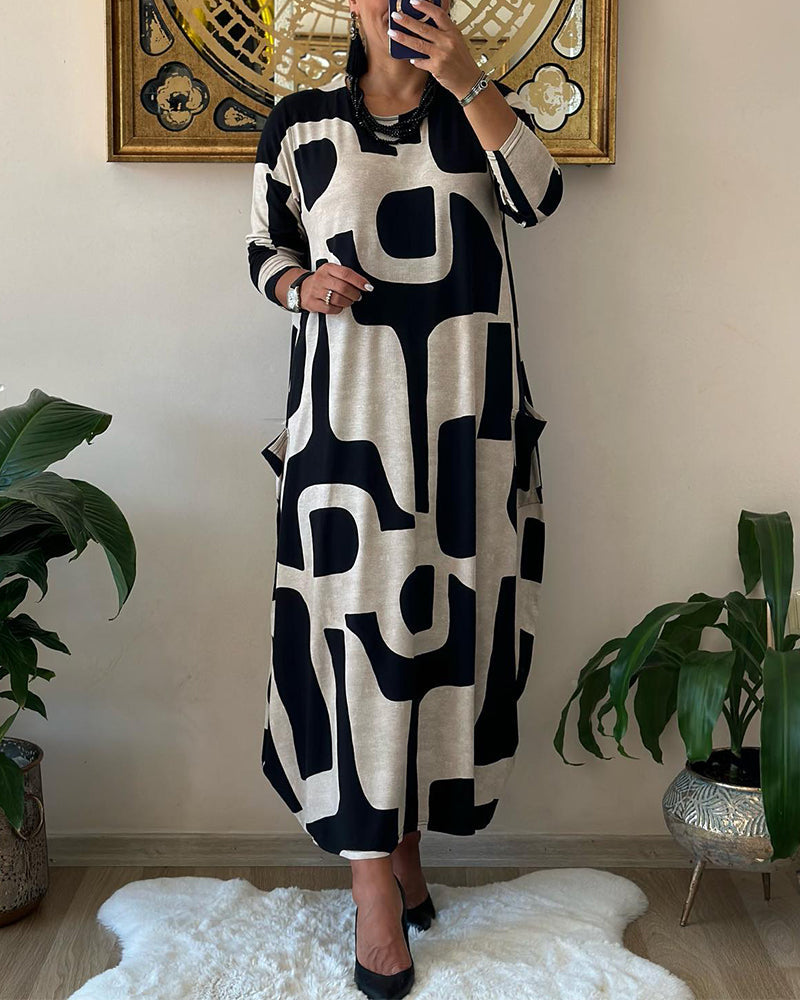 Vrouwelijke Jurk met Lange Mouwen Zwart Witte Bloemenprint - Mode Vibes