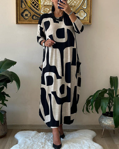 Vrouwelijke Jurk met Lange Mouwen Zwart Witte Bloemenprint - Mode Vibes